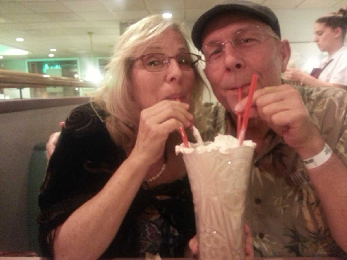 Sharing a milkshake