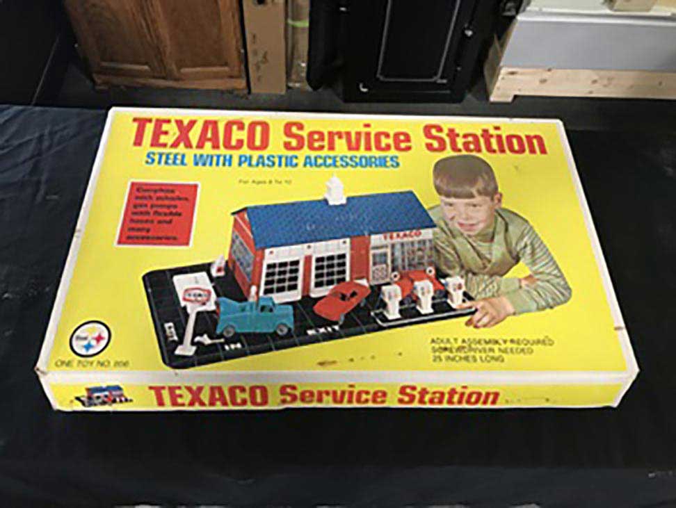 A toy service station, released by TEXICO in 1960.