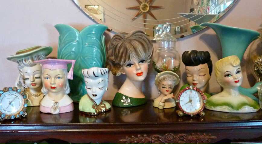 display multiple lady head vases together