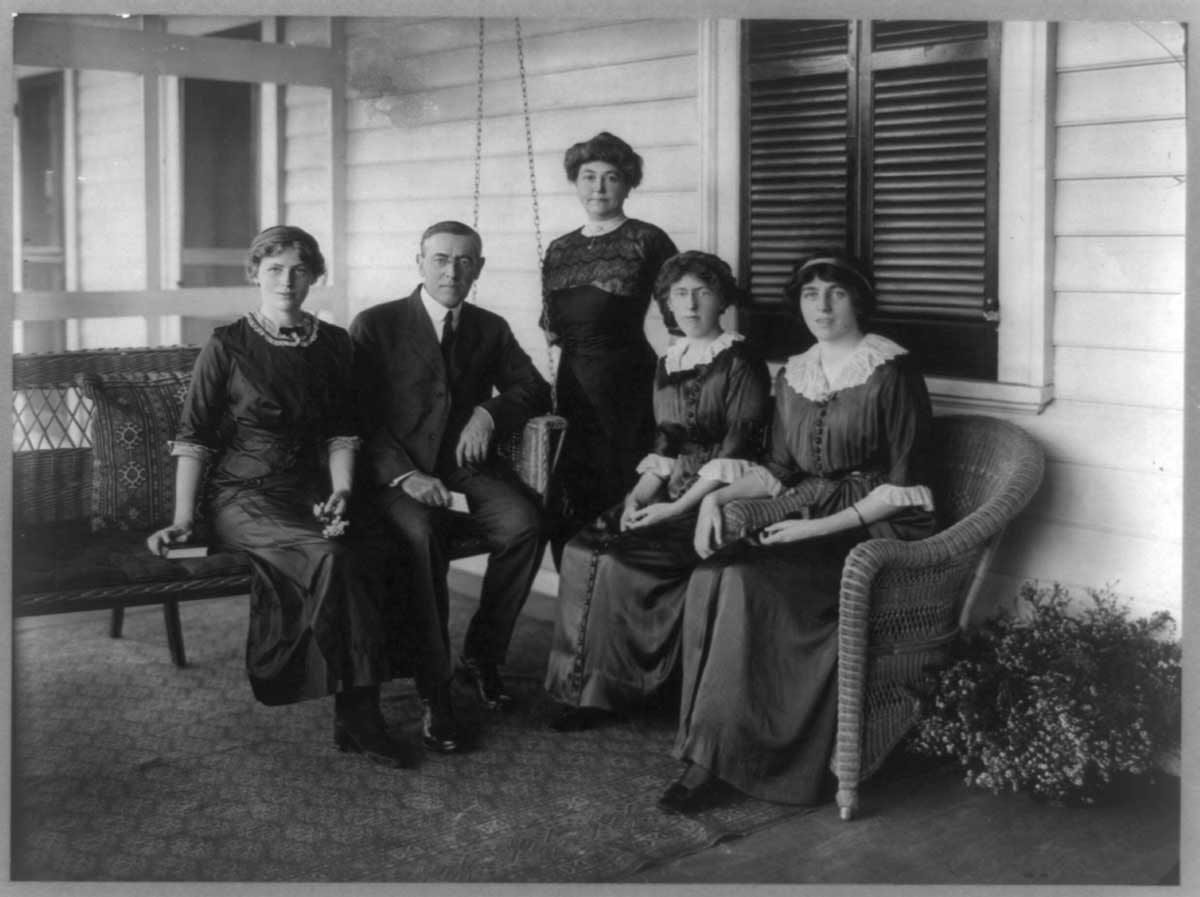 Woodrow Wilson is photographed with his daughters on<br />
their porch swing